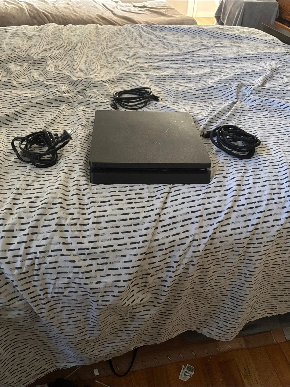 Sony Black PlayStation Slim Console with Cables
